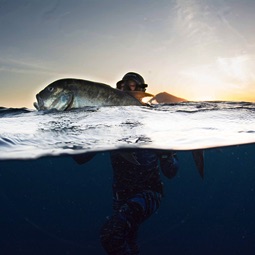 Andrea De Camilli with a Giant Trevally in Indonesia